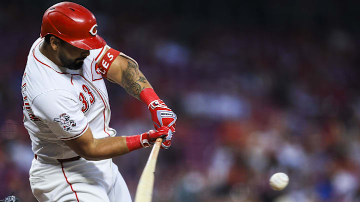 Jul 8, 2025; Cincinnati, Ohio, USA; Cincinnati Reds first baseman Christian Encarnacion-Strand (33) hits a single in the seventh inning against the Miami Marlins at Great American Ball Park. Mandatory Credit: Katie Stratman-Imagn Images