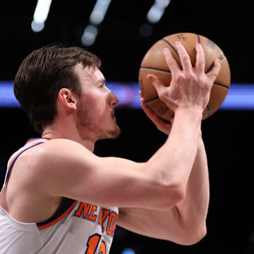 Apr 13, 2025; Brooklyn, New York, USA; New York Knicks guard Tyler Kolek (13) shoots the ball  during the first half against the Brooklyn Nets at Barclays Center. Mandatory Credit: Vincent Carchietta-Imagn Images