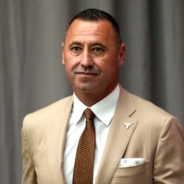 July 15, 2025; Atlanta, GA, USA; Texas head coach Steve Sarkisian waits off stage as he is introduced during SEC Media Days at the College Football Hall of Fame in Atlanta.