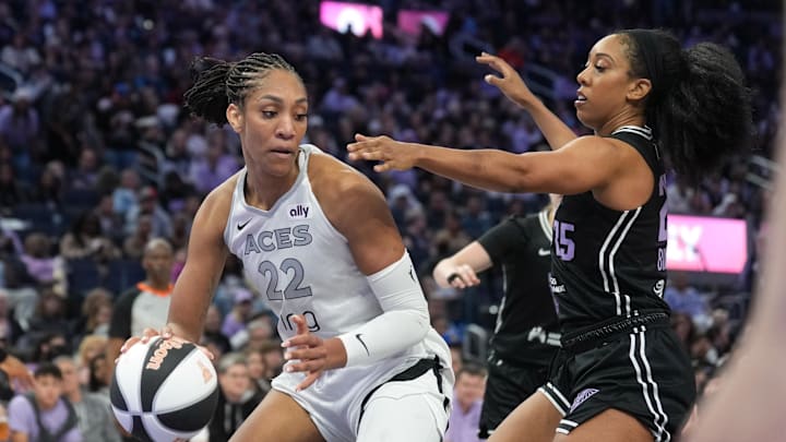 Jun 7, 2025; San Francisco, California, USA; Las Vegas Aces center A'ja Wilson (22) dribbles against Golden State Valkyries forward Monique Billings (right) during the third quarter at Chase Center. Mandatory Credit: Darren Yamashita-Imagn Images