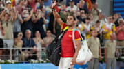 Rafael Nadal waves to the crowd at the 2024 Paris Olympics after losing a match.