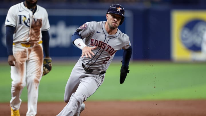 Aug 13, 2024; St. Petersburg, Florida, USA; Houston Astros third baseman Alex Bregman (2) rounds third base to score a run against the Tampa Bay Rays in the third inning at Tropicana Field.