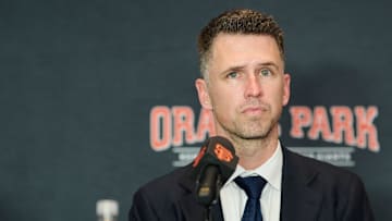 Dec 12, 2024; San Francisco, CA, USA; San Francisco Giants president of baseball operations Buster Posey listens during the introductory press conference for shortstop Willy Adames (not pictured) at Oracle Park.  
