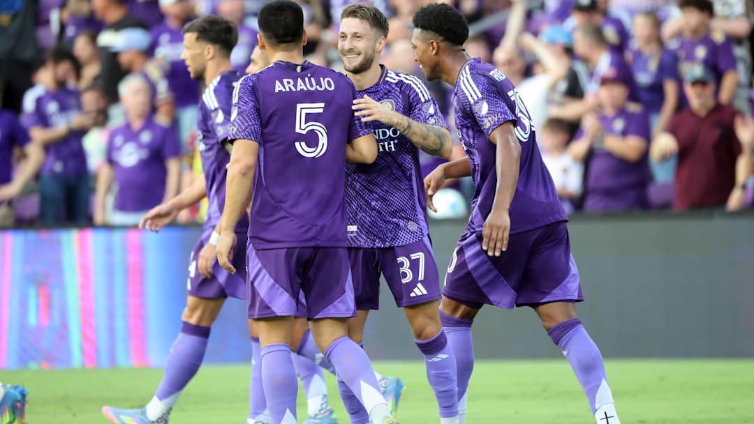 May 21, 2025; Orlando, Florida, USA; Orlando City forward Marco Pasalic (87) is congratulated by midfielder Cesar Araujo (5) after scoring a goal against the Nashville SC  during the first half at Inter&Co Stadium. Mandatory Credit: Kim Klement Neitzel-Imagn Images