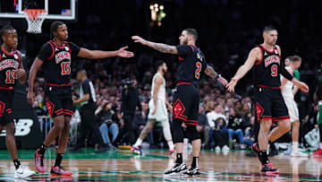 Dec 19, 2024; Boston, Massachusetts, USA; Chicago Bulls guard Lonzo Ball (2), center Nikola Vucevic (9) and forward Julian Phillips (15) react during a break in the action against the Boston Celtics in the second quarter at TD Garden. Mandatory Credit: David Butler II-Imagn Images
