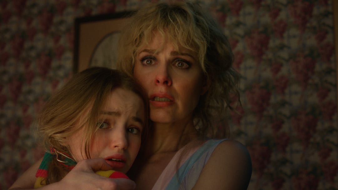 (L to R) Nell Fisher as Holly Wheeler and Cara Buono as Karen Wheeler in Stranger Things 5 (L to R) Nell Fisher as Holly Wheeler and Cara Buono as Karen Wheeler in Stranger Things 5