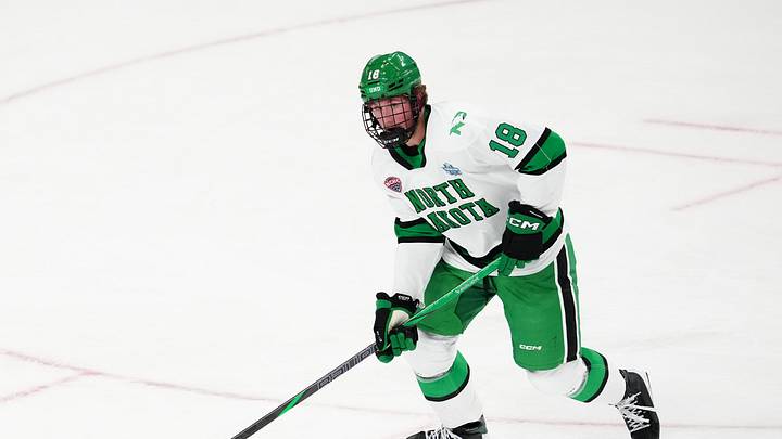 Apr 9, 2026; Las Vegas, Nevada, UNITED STATES; North Dakota Fighting Hawks defenseman Keaton Verhoeff (18) moves the puck in the first period against the Wisconsin Badgers in the semifinals of the NCAA men's ice hockey Frozen Four at T-Mobile Arena. Apr 9, 2026; Las Vegas, Nevada, UNITED STATES; North Dakota Fighting Hawks defenseman Keaton Verhoeff (18) moves the puck in the first period against the Wisconsin Badgers in the semifinals of the NCAA men's ice hockey Frozen Four at T-Mobile Arena.