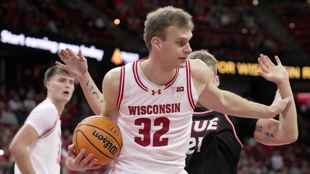 Wisconsin forward Aleksas Bieliauskas (32) wrestles the ball away from Southern Illinois-Edwardsville forward Myles Thompson (21) during the first half of their game Monday, November 17, 2025 at the Kohl Center in Madison, Wisconsin. Wisconsin forward Aleksas Bieliauskas (32) wrestles the ball away from Southern Illinois-Edwardsville forward Myles Thompson (21) during the first half of their game Monday, November 17, 2025 at the Kohl Center in Madison, Wisconsin.