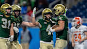 Sean Walicki (9) of Jackson Lumen Christi celebrates with his teammates after scoring a touchdown against Kingsley during the second half of the MHSAA Division 6 football state championship at Ford Field in Detroit on Friday, Nov. 28, 2025.