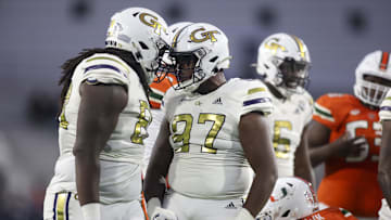 Nov 12, 2022; Atlanta, Georgia, USA; Georgia Tech Yellow Jackets defensive lineman Zeek Biggers (88) and defensive lineman Akelo Stone (97) celebrate after a tackle against the Miami Hurricanes in the second half at Bobby Dodd Stadium. Mandatory Credit: Brett Davis-Imagn Images