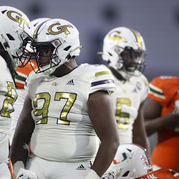 Nov 12, 2022; Atlanta, Georgia, USA; Georgia Tech Yellow Jackets defensive lineman Zeek Biggers (88) and defensive lineman Akelo Stone (97) celebrate after a tackle against the Miami Hurricanes in the second half at Bobby Dodd Stadium. Mandatory Credit: Brett Davis-Imagn Images