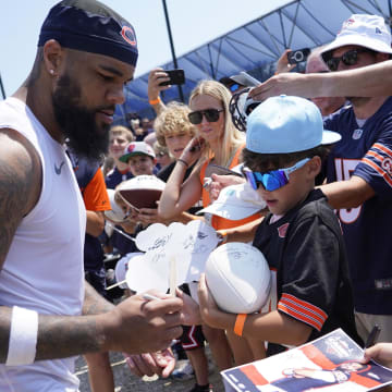 Keenan Allen signs autographs at Bears camp. Allen named a teammate who should have been on the top 100 list.