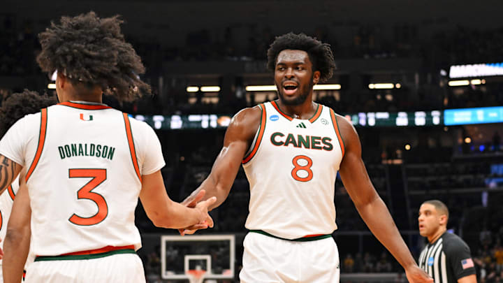 Mar 20, 2026; St. Louis, MO, USA; Miami (FL) Hurricanes center Ernest Udeh Jr. (8) and Miami (FL) Hurricanes guard Tre Donaldson (3) react after a play during the first half against the Missouri Tigers during a first round game of the men's 2026 NCAA Tournament at Enterprise Center. Mandatory Credit: Jeff Curry-Imagn Images