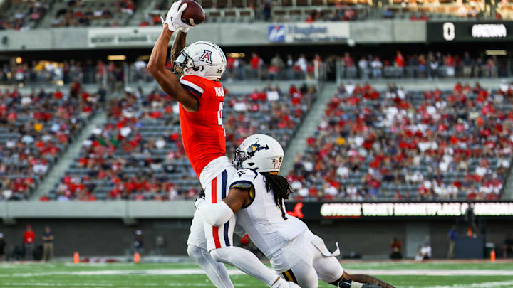 Oct 26, 2024; Tucson, Arizona, USA; Arizona Wildcats wide receiver Tetairoa McMillan (4) catches the ball during the second quarter against the West Virginia Mountaineers at Arizona Stadium. Mandatory Credit: Aryanna Frank-Imagn Images