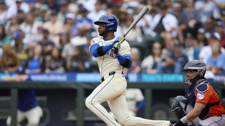 Seattle Mariners right fielder Victor Robles (10) hits a double against the Houston Astros during the first inning at T-Mobile Park in 2024.