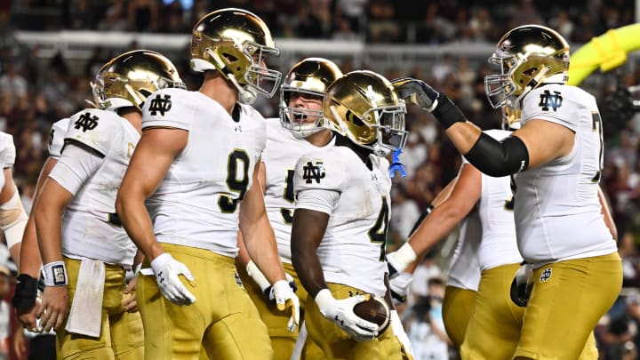 Aug 31, 2024; College Station, Texas, USA; Notre Dame Fighting Irish defensive lineman Joshua Burnham (4) celebrates with teammates after scoring a touchdown in the fourth quarter against the Texas A&M Aggies at Kyle Field.