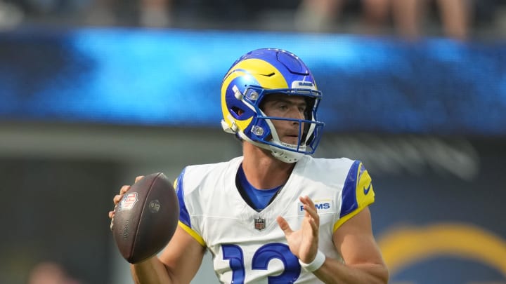 Aug 17, 2024; Inglewood, California, USA; Los Angeles Rams quarterback Stetson Bennett (13) throws the ball against the Los Angeles Chargers in the first half at SoFi Stadium. Mandatory Credit: Kirby Lee-USA TODAY Sports