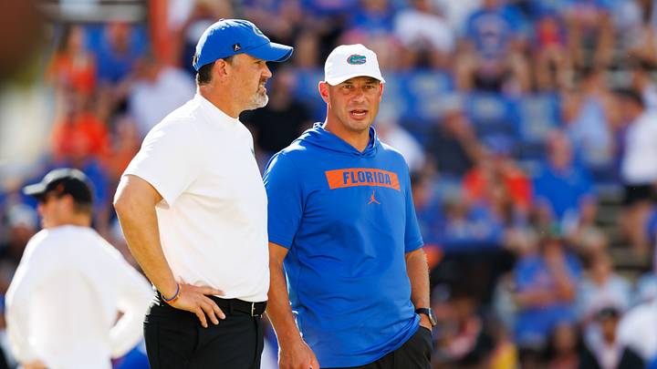 Sep 12, 2026; Gainesville, Florida, USA; Florida Gators defensive coordinator Brad White and Florida Gators head coach Jon Sumrall talk before a game against the Campbell Fighting Camels at Ben Hill Griffin Stadium. Mandatory Credit: Matt Pendleton-Imagn Images