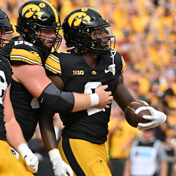 Sep 14, 2024; Iowa City, Iowa, USA; Iowa Hawkeyes running back Kaleb Johnson (2) reacts with fullback Hayden Large (88) and offensive lineman Logan Jones (65) after running for a 4 yard touchdown against the Troy Trojans during the second quarter at Kinnick Stadium. Mandatory Credit: Jeffrey Becker-Imagn Images