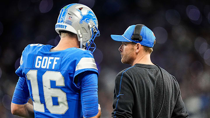 Detroit Lions quarterback Jared Goff (16), left, talks to offensive coordinator Ben Johnson before a play against Chicago Bears during the first half at Ford Field in Detroit on Thursday, Nov. 28, 2024. Detroit Lions quarterback Jared Goff (16), left, talks to offensive coordinator Ben Johnson before a play against Chicago Bears during the first half at Ford Field in Detroit on Thursday, Nov. 28, 2024.