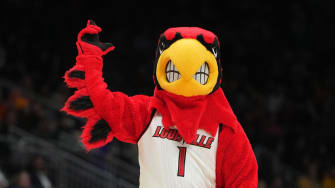 Mar 24, 2023; Seattle, WA, USA; Louisville Cardinals mascot Louie gestures against the Ole Miss Rebels in the first half at Climate Pledge Arena.