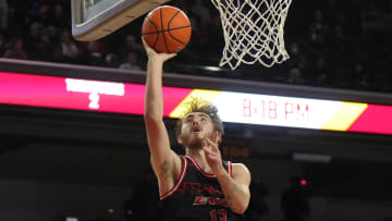 Nov 29, 2023; Los Angeles, California, USA Eastern Washington Eagles guard Jake Kyman (13) shoots the ball against the Southern California Trojans in the first half at Galen Center. Mandatory Credit: Kirby Lee-USA TODAY Sports