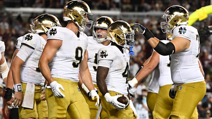 Aug 31, 2024; College Station, Texas, USA; Notre Dame Fighting Irish defensive lineman Joshua Burnham (4) celebrates with teammates after scoring a touchdown in the fourth quarter against the Texas A&M Aggies at Kyle Field. Mandatory Credit: Maria Lysaker-Imagn Images