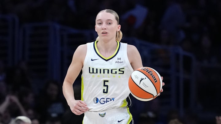 Dallas Wings guard Paige Bueckers (5) dribbles the ball against the LA Sparks in the first half at Crypto.com Arena. Mandatory Credit: Kirby Lee-Imagn Images