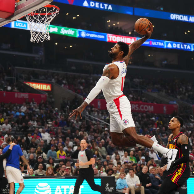 Mar 17, 2024; Los Angeles, California, USA; LA Clippers forward Paul George (13) dunks the ball against the Atlanta Hawks in the first half at Crypto.com Arena. Mandatory Credit: Kirby Lee-USA TODAY Sports