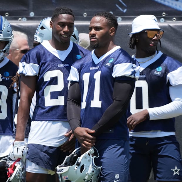 Dallas Cowboys defenders Israel Mukuamu, Micah Parsons, and DeMarvion Overshown during training camp 