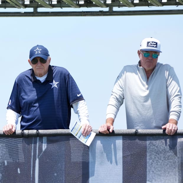 Dallas Cowboys owner Jerry Jones watches with son Stephen Jones during training camp at the River Ridge Fields.