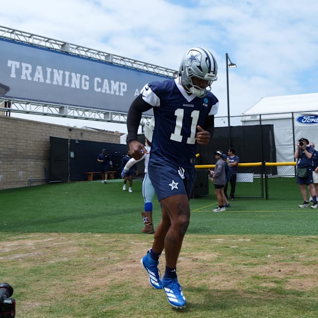 Dallas Cowboys defensive end Micah Parsons enters the field during training camp at the River Ridge Fields. 