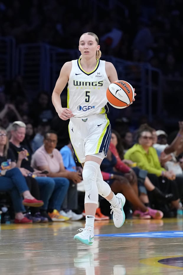 Dallas Wings guard Paige Bueckers dribbles the ball against the LA Sparks in the first half at Crypto.com Arena.