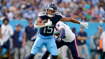 Tennessee Titans wide receiver Nick Westbrook-Ikhine (15) slips away from New England Patriots safety Marte Mapu (15) for a first down in the third quarter at Nissan Stadium in Nashville, Tenn., Sunday, Nov. 3, 2024.