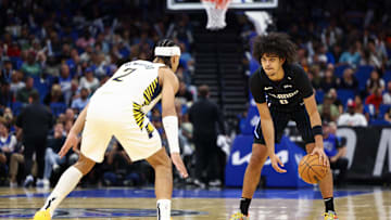 Oct 28, 2024; Orlando, Florida, USA; Orlando Magic guard Anthony Black (0) is guarded by Indiana Pacers guard Andrew Nembhard (2) in the first quarter at Kia Center. Mandatory Credit: Nathan Ray Seebeck-Imagn Images