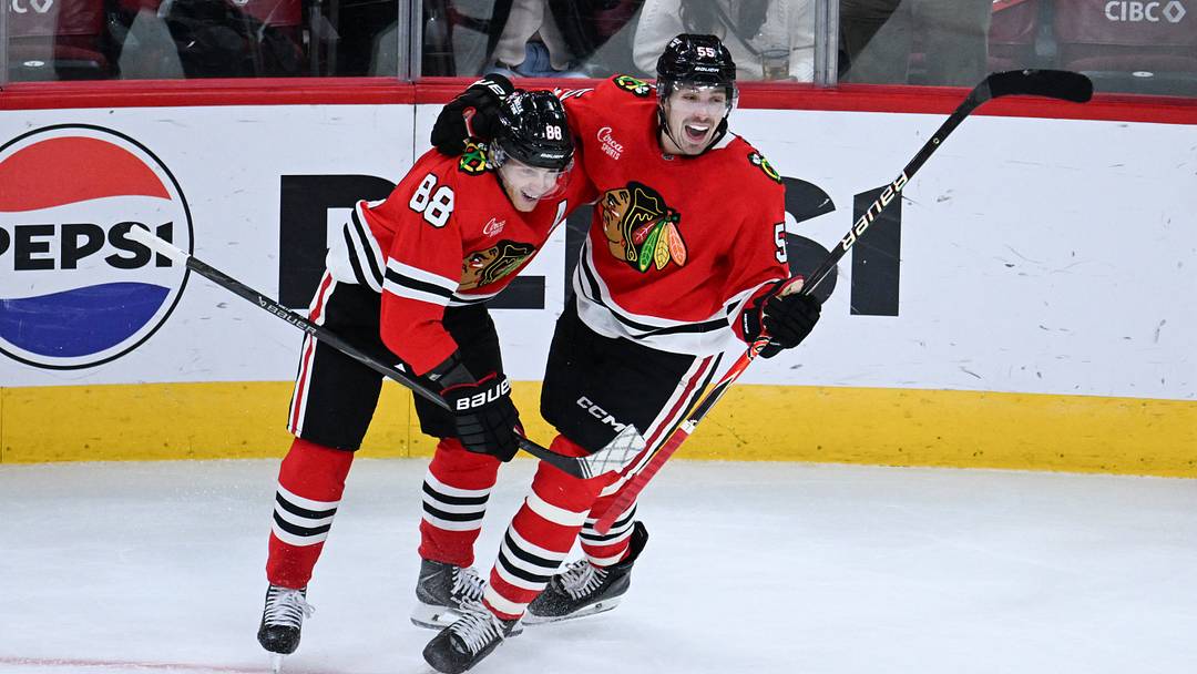 Oct 15, 2026; Chicago, Illinois, USA;  Chicago Blackhawks defenseman Artyom Levshunov (55) celebrates with right wing Patrick Kane (88) after he scores the game winning goal during the overtime period against the Winnipeg Jets at the United Center.  Mandatory Credit: Matt Marton-Imagn Images