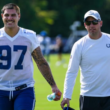 Indianapolis Colts defensive end Laiatu Latu (97) smiles while walking toward a member of the media Saturday, July 27, 2024, during the Indianapolis Colts’ training camp at Grand Park Sports Complex in Westfield.