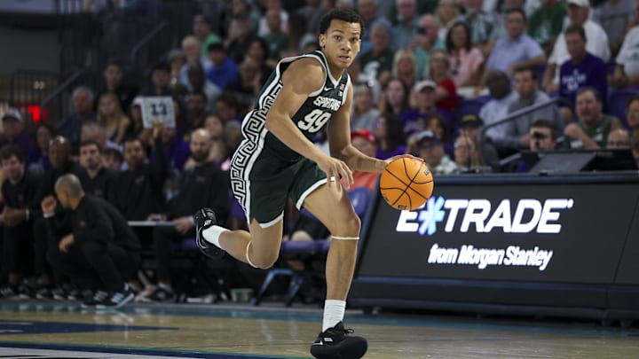 Nov 25, 2025; Fort Myers, Florida, USA; Michigan State Spartans guard Divine Ugochukwu (99) controls the ball against the East Carolina Pirates in the second half at Suncoast Credit Union Arena. Mandatory Credit: Nathan Ray Seebeck-Imagn Images