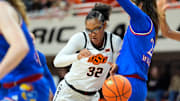 Oklahoma State Cowgirls guard Stailee Heard (32) loses the ball beside Kansas Jayhawks forward Regan Williams (24) during a women's BIG 12 basketball game between the Oklahoma State University Cowgirls (OSU) and the Kansas Jayhawks at Gallagher-Iba Arena in Stillwater, Okla., Saturday, Jan. 4, 2025.