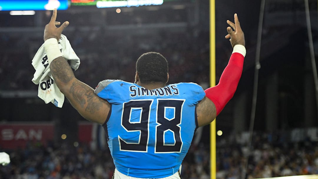 Aug 22, 2025; Nashville, Tennessee, USA;   Tennessee Titans defensive tackle Jeffery Simmons (98) celebrates against the Minnesota Vikings during the first half at Nissan Stadium. Mandatory Credit: Steve Roberts-Imagn Images