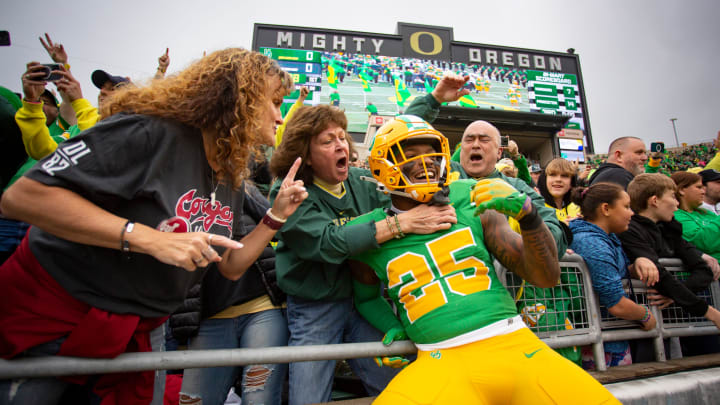 Oregon running back Brison Cobbins leaps into the stands as the No. 9 Oregon Ducks host Washington State Saturday, Oct. 21, 2023, at Autzen Stadium in Eugene, Ore.