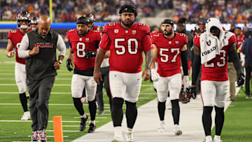 Nov 23, 2025; Inglewood, California, USA; Tampa Bay Buccaneers defensive tackle Vita Vea (50) walks off the field during halftime with linebacker SirVocea Dennis (8), linebacker John Bullock (57) and safety Tykee Smith (23) against the Los Angeles Rams at SoFi Stadium. Mandatory Credit: Kiyoshi Mio-Imagn Images