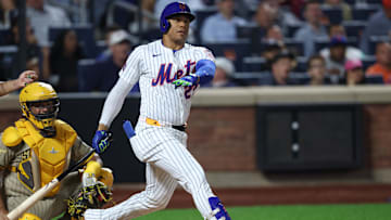 Sep 17, 2025; New York City, New York, USA; New York Mets right fielder Juan Soto (22) hits a home run during the fifth inning against the San Diego Padres at Citi Field. Mandatory Credit: Vincent Carchietta-Imagn Images