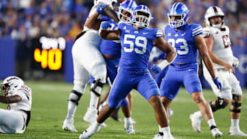 Logan Lutui celebrates a defensive stop against Southern Illinois.