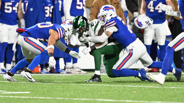 Nov 19, 2023; Orchard Park, NY; Buffalo Bills safety Taylor Rapp (left) was injured on a tackle of New York Jets running back Breece Hall (20) requiring an ambulance in the second quarter. Also in the play is Buffalo Bills cornerback Taron Johnson (7) at Highmark Stadium. 