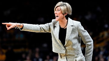 Iowa Hawkeyes head coach Jan Jensen coaches from the sidelines against the Purdue Boilermakers Sunday, Dec. 29, 2024 at Carver-Hawkeye Arena in Iowa City, Iowa.