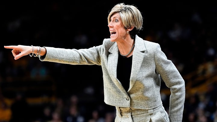 Iowa Hawkeyes head coach Jan Jensen coaches from the sidelines against the Purdue Boilermakers Sunday, Dec. 29, 2024 at Carver-Hawkeye Arena in Iowa City, Iowa.