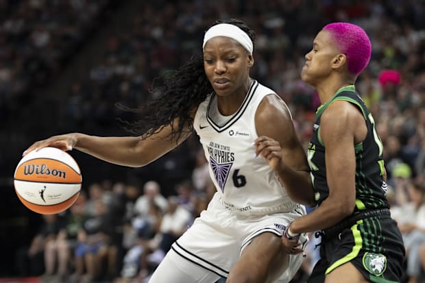 Golden State Valkyries guard Kaila Charles dribbles the ball as Minnesota Lynx guard Courtney Williams plays defense