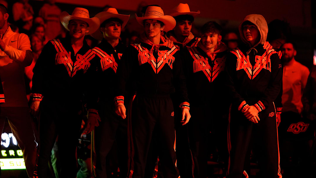 Oklahoma State's Jax Forrest, center, is introduced before a Bedlam wrestling dual between the Oklahoma State Cowboys (OSU) and the University of Oklahoma Sooners (OU) at Gallagher-Iba in Stillwater, Okla., Sunday, Jan. 11, 2026.
