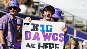 Sep 21, 2024; Seattle, Washington, USA; A Washington Huskiies fan holds a sign before the team’s first Big Ten conference game against the Northwestern Wildcats at Alaska Airlines Field at Husky Stadium. Mandatory Credit: Joe Nicholson-Imagn Images